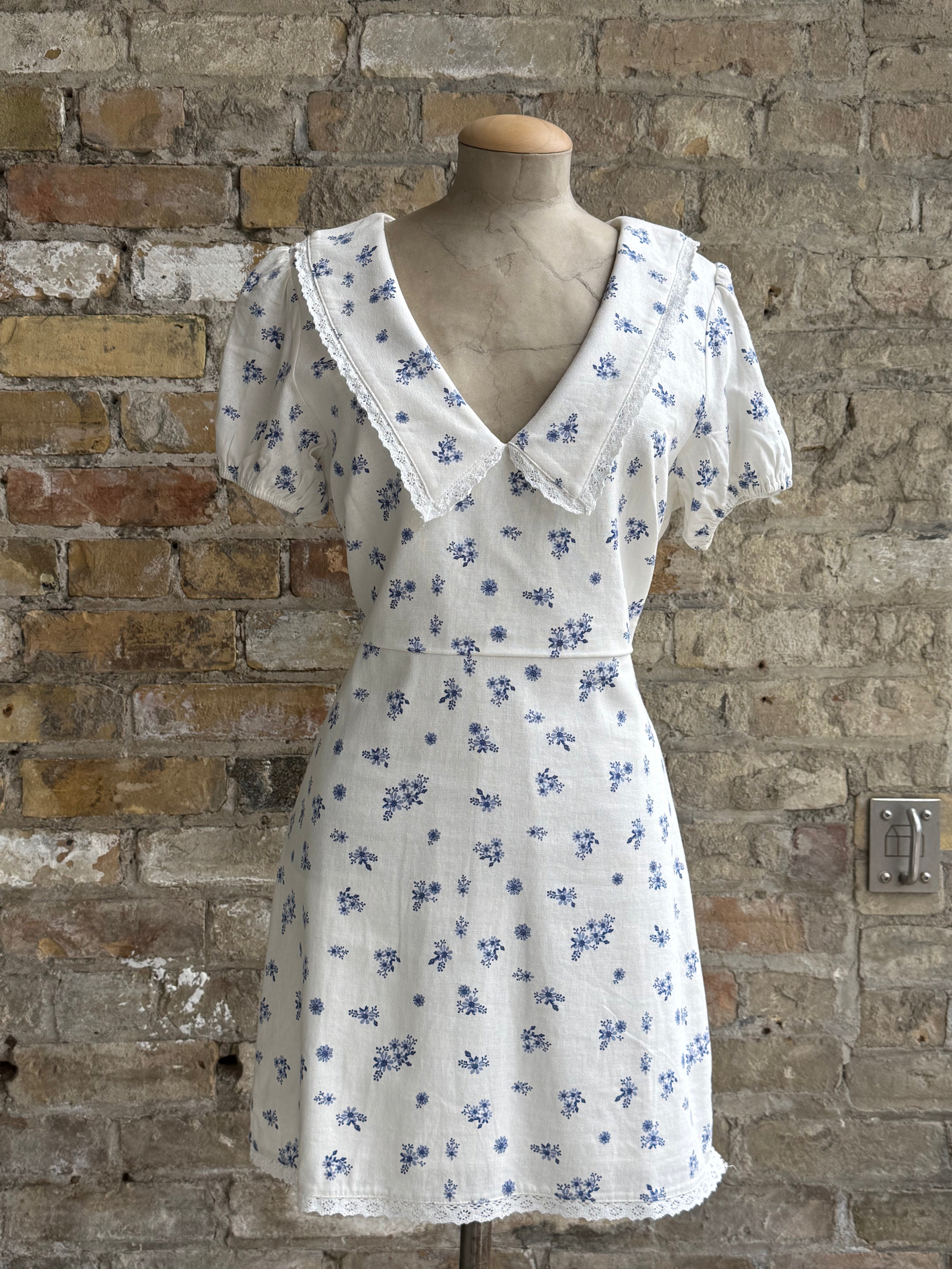 White short dress with blue flowers