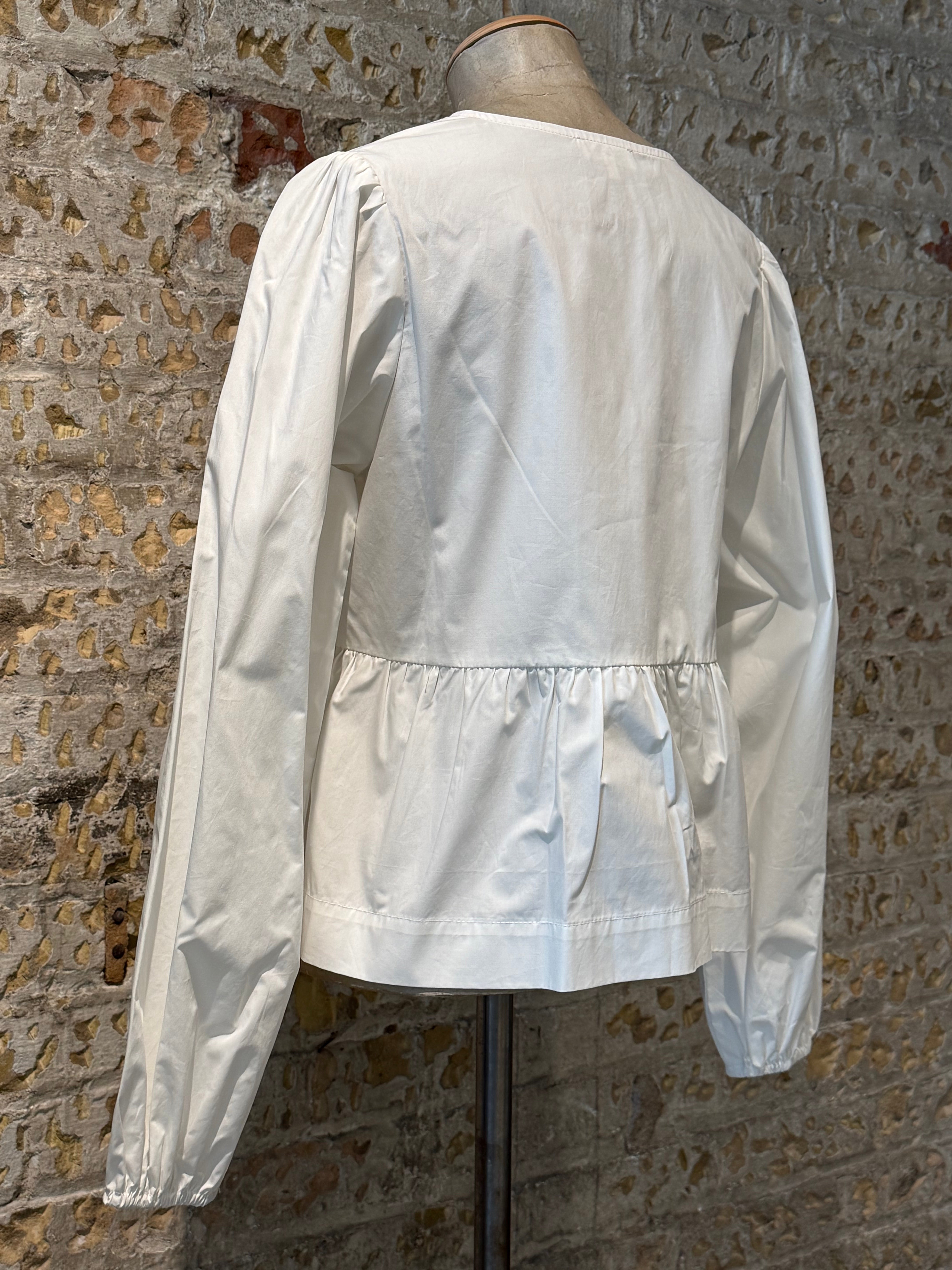 White top with bows on the front