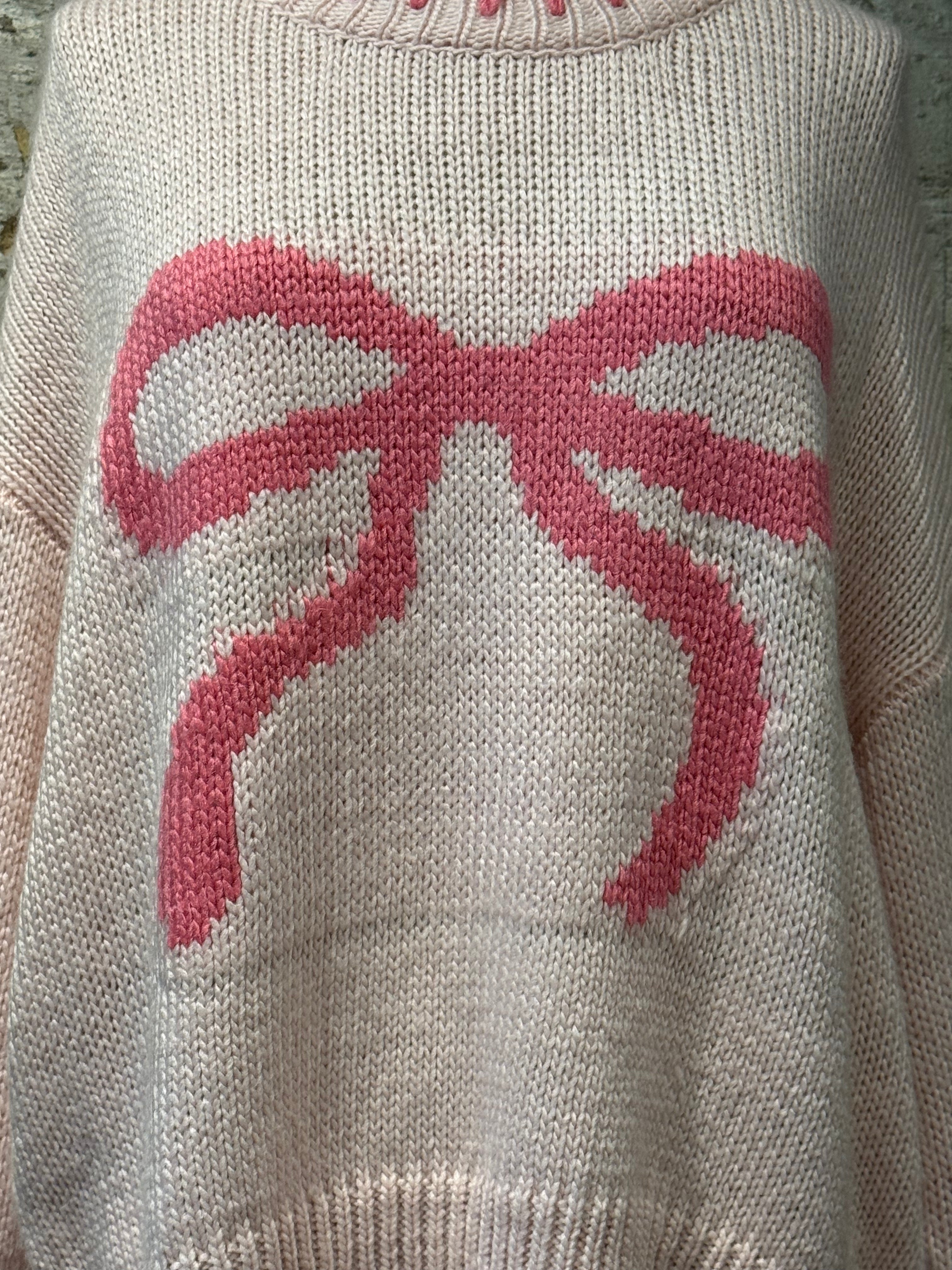 Pink crochet sweater, with bow print