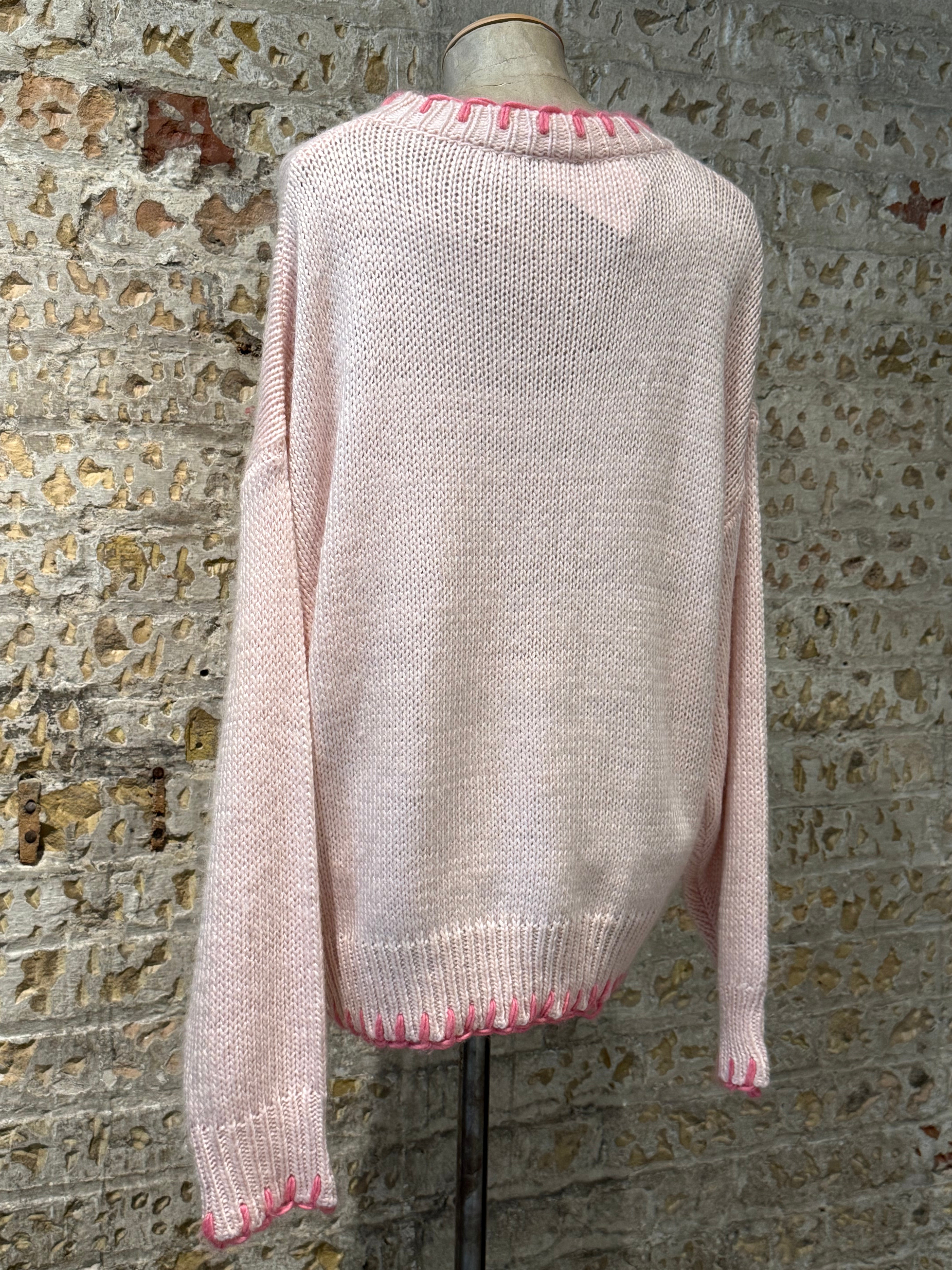 Pink crochet sweater, with bow print