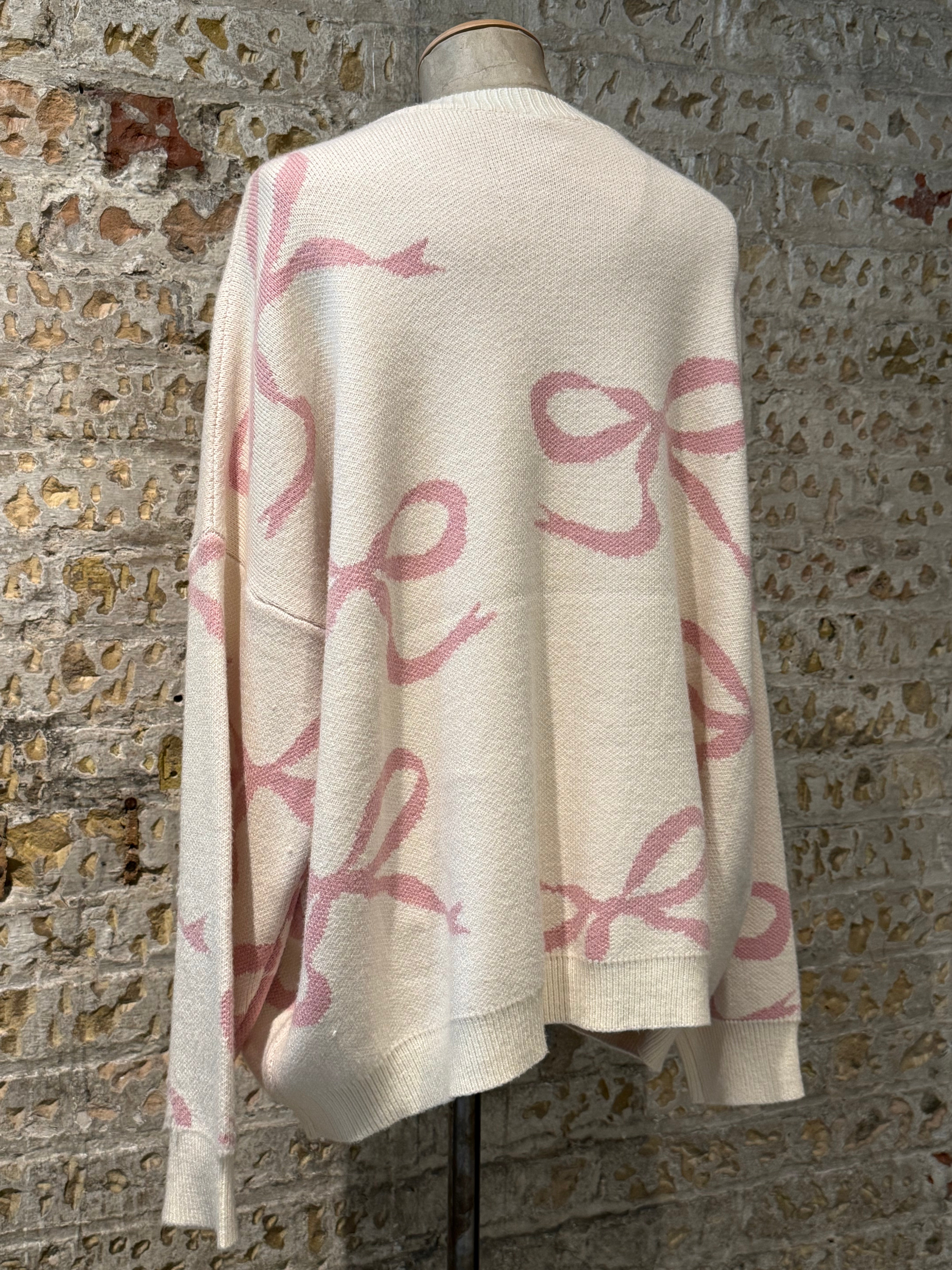 Sweater with pink bow prints
