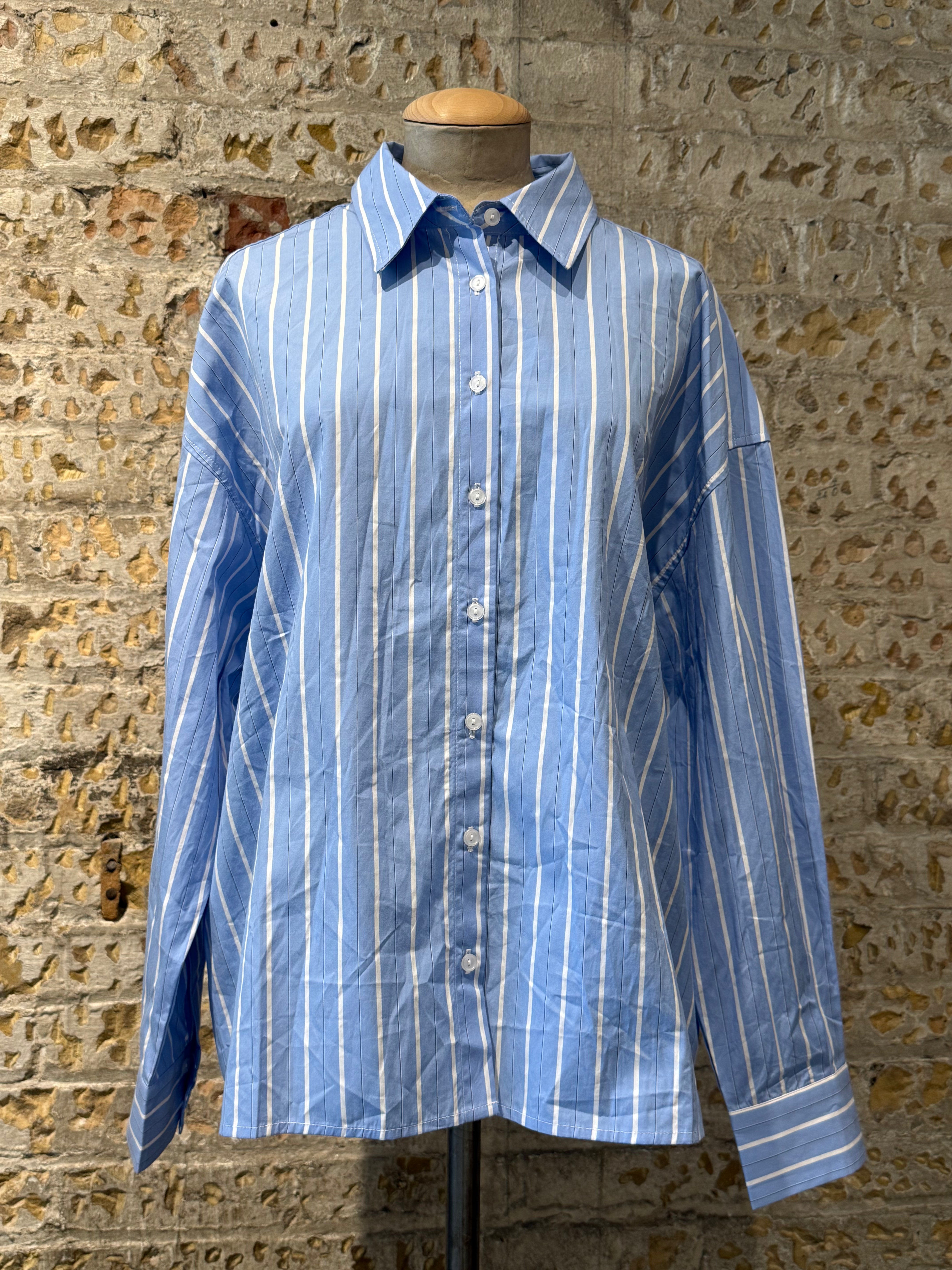 Blue shirt with white lines, long sleeves with buttons