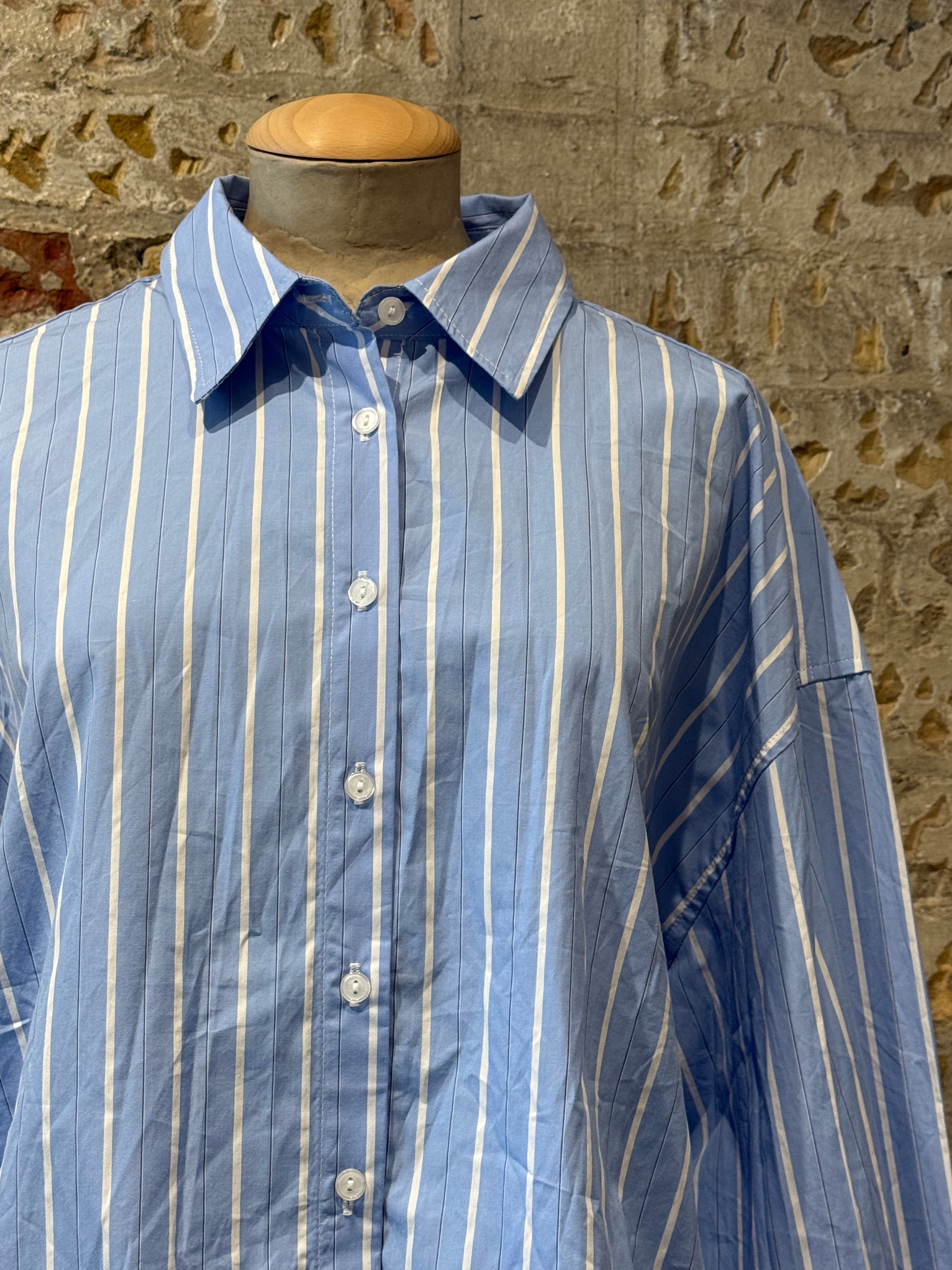 Blue shirt with white lines, long sleeves with buttons