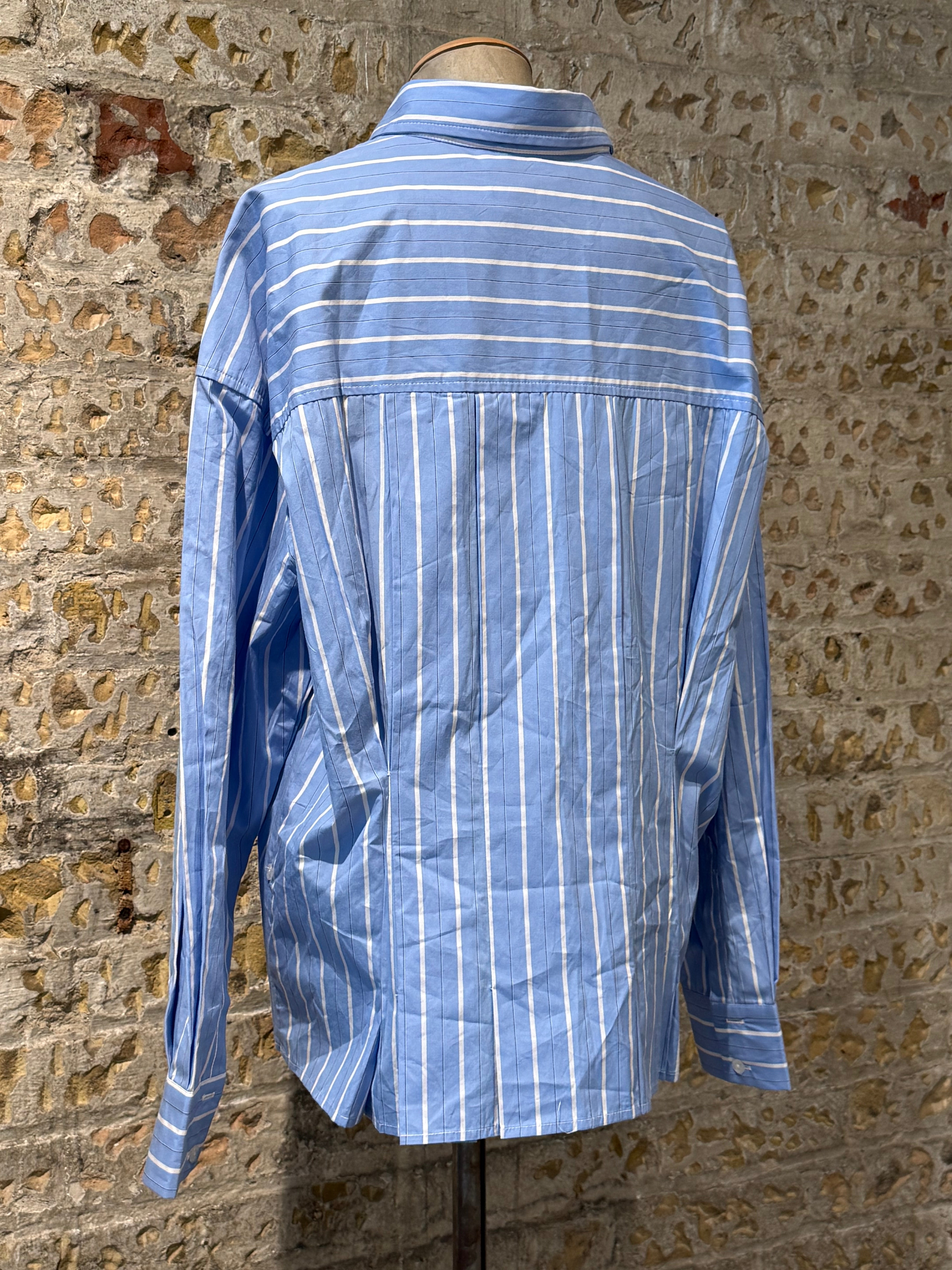 Blue shirt with white lines, long sleeves with buttons