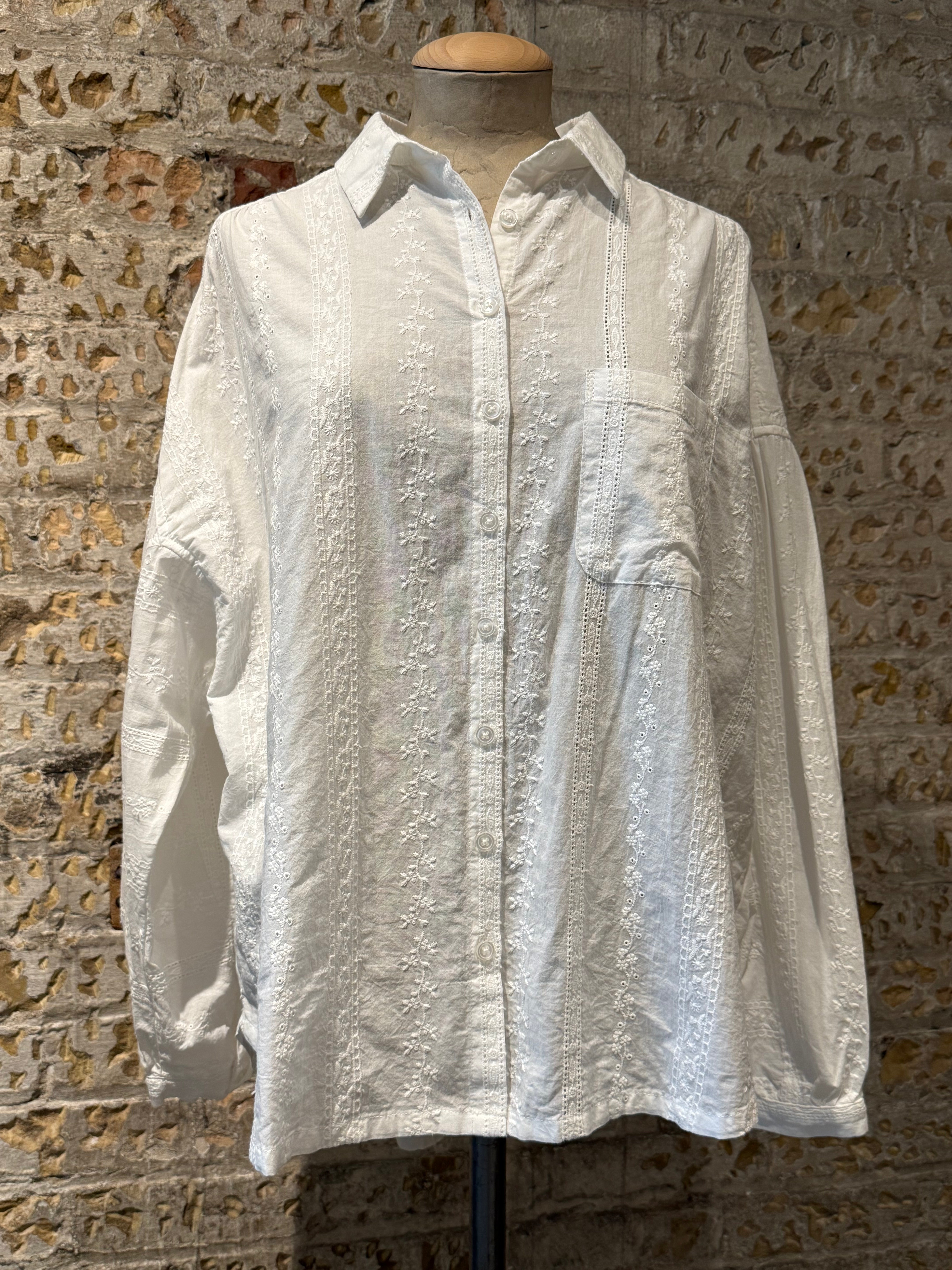White long sleeve blouse and boot with cute details on blouse